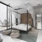 Cama de matrimonio con dosel en dormitorio blanco, gris y negro