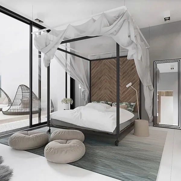 Cama de matrimonio con dosel en dormitorio blanco, gris y negro