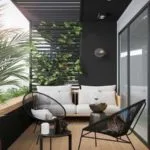 Terraza moderna parcialmente techada con muebles blancos y negros