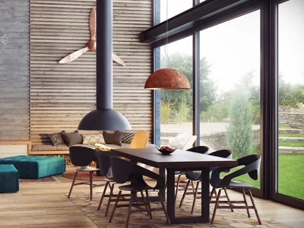 comedor estilo industrial con chimenea y lampara colgante